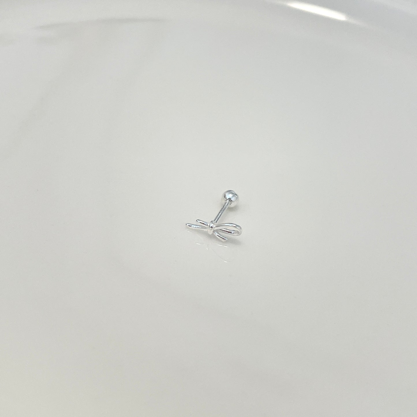 Knot and glow piercing