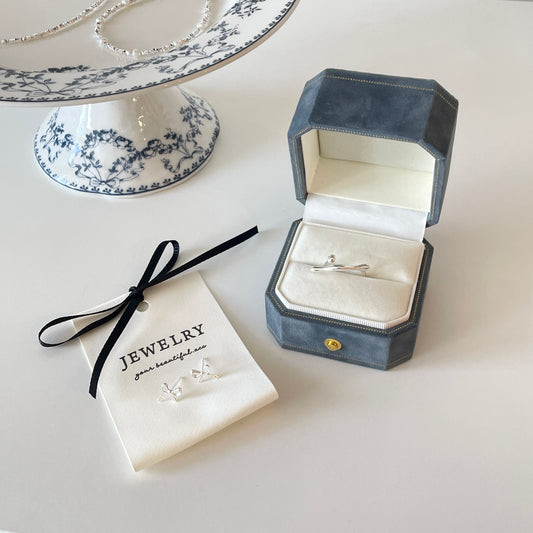 Silver bow stud earrings