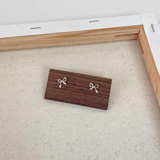 Silver bow stud earrings
