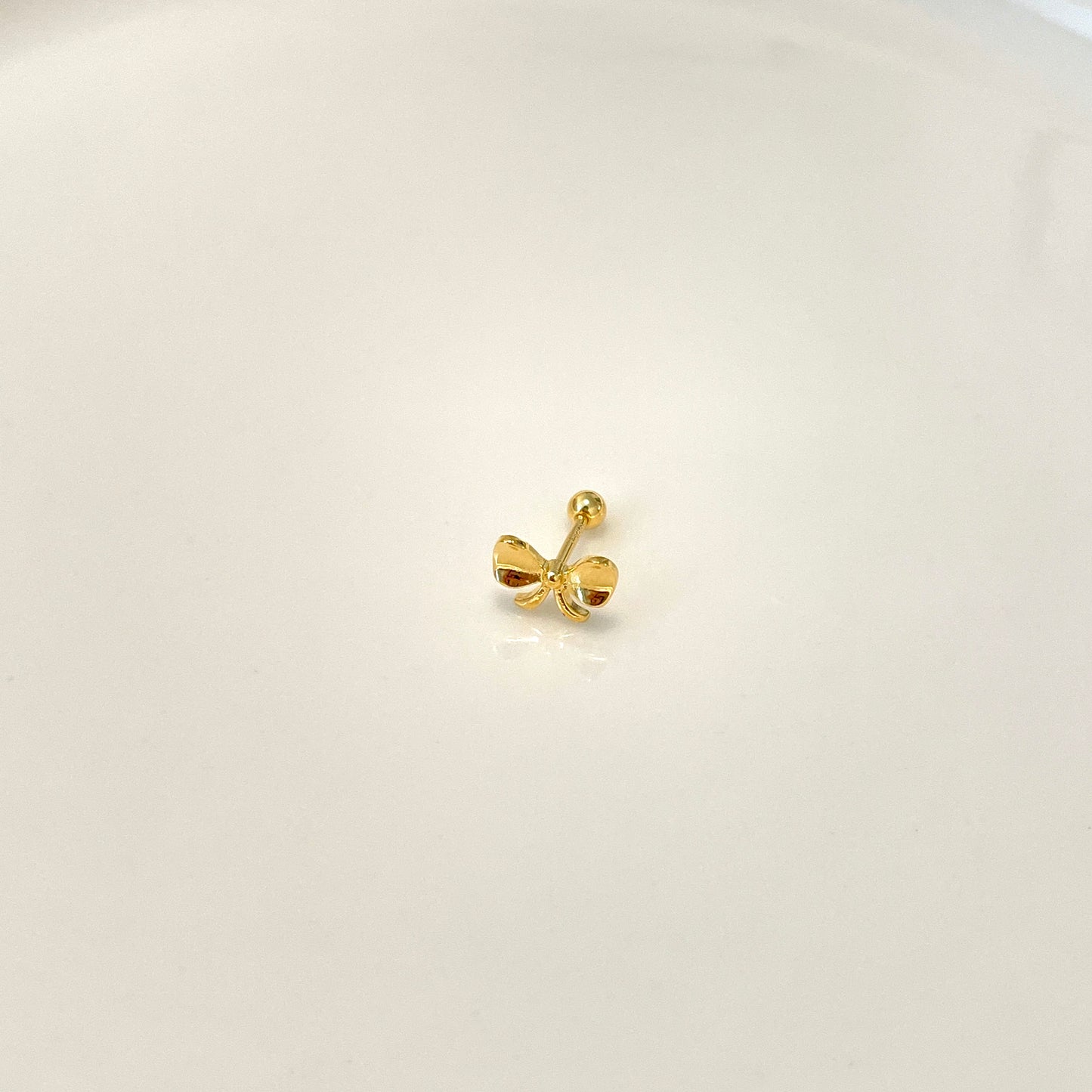 Golden snitch piercing